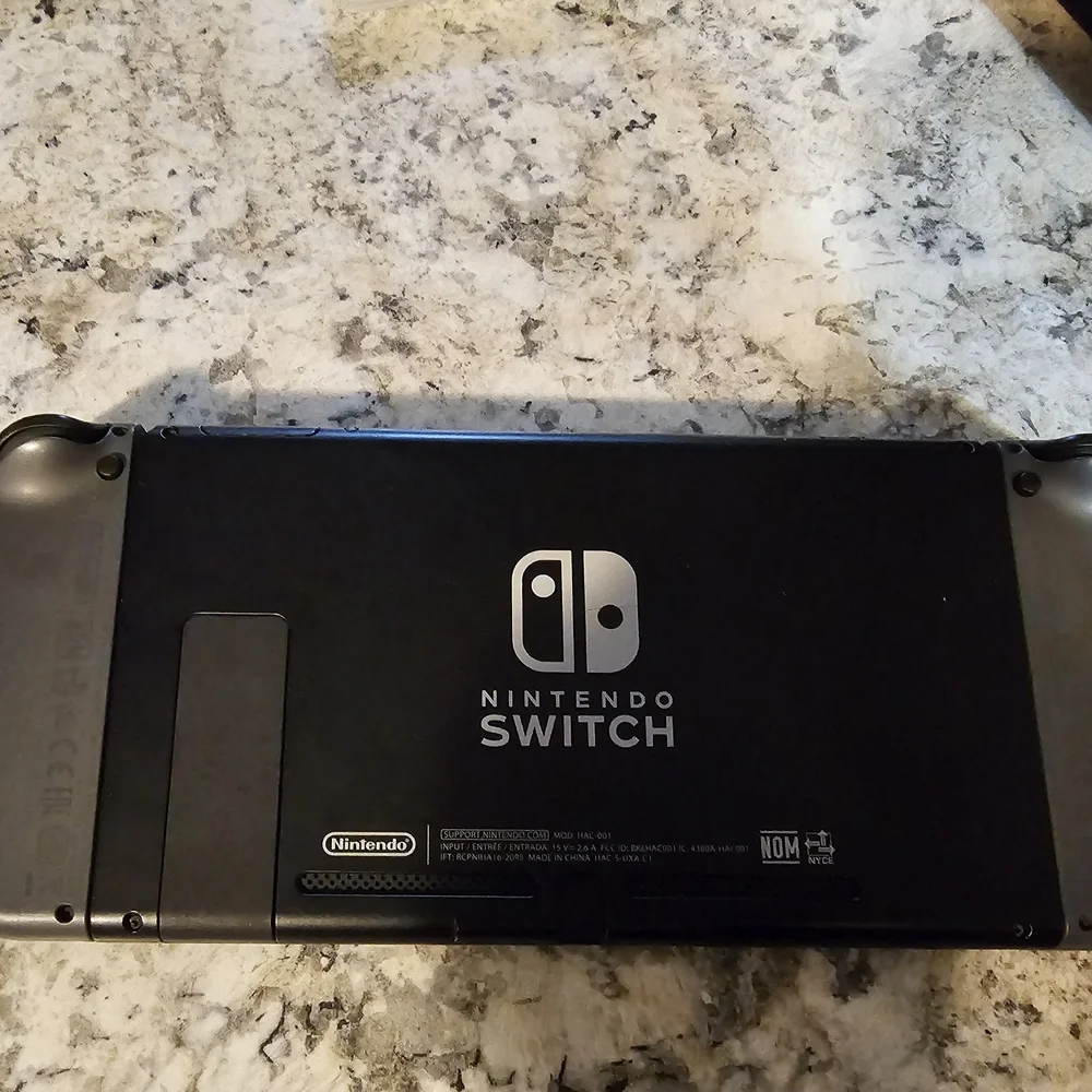 Nintendo Switch with Gray Joy-Con Controllers, Joy Con Grip, And 2 Games. No Doc